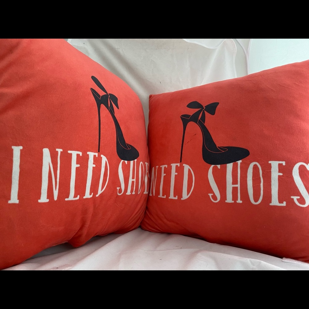 2 “I NEED SHOES” throw pillows. Like new.